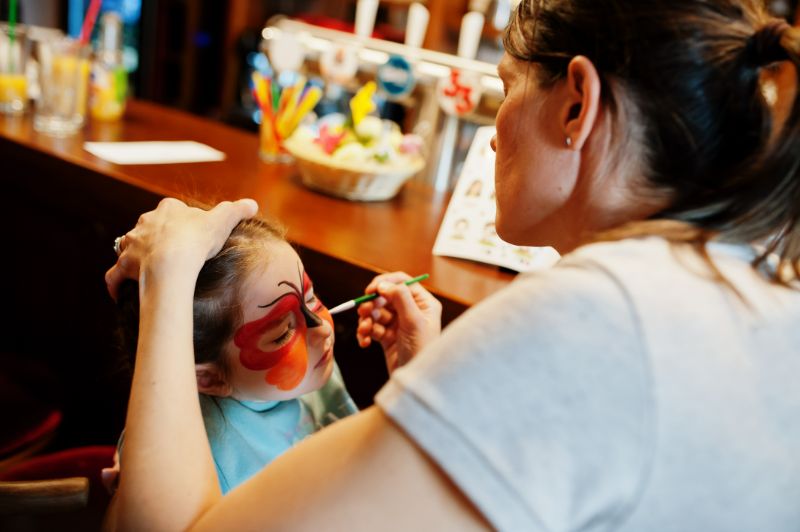preparing-easter-concept-woman-doing-aqua-makeup-baby-girl.jpg